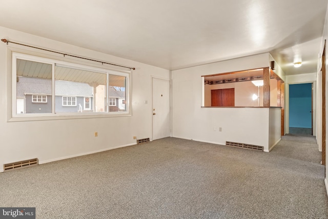 unfurnished living room with carpet floors