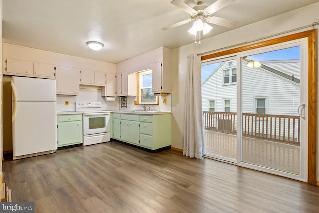 kitchen with white cabinets, dark hardwood / wood-style flooring, white appliances, and green cabinetry