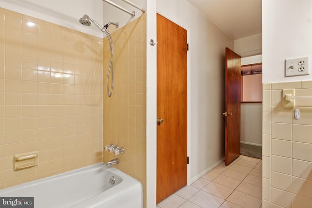 bathroom with tile patterned floors and tiled shower / bath