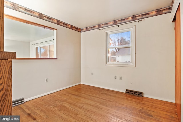 unfurnished room featuring light wood-type flooring