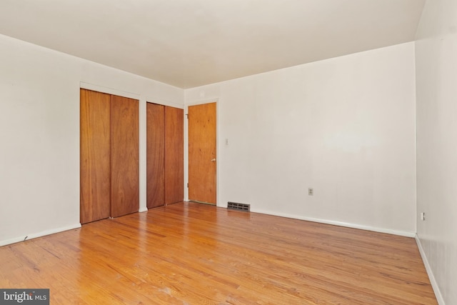 unfurnished bedroom with light hardwood / wood-style floors