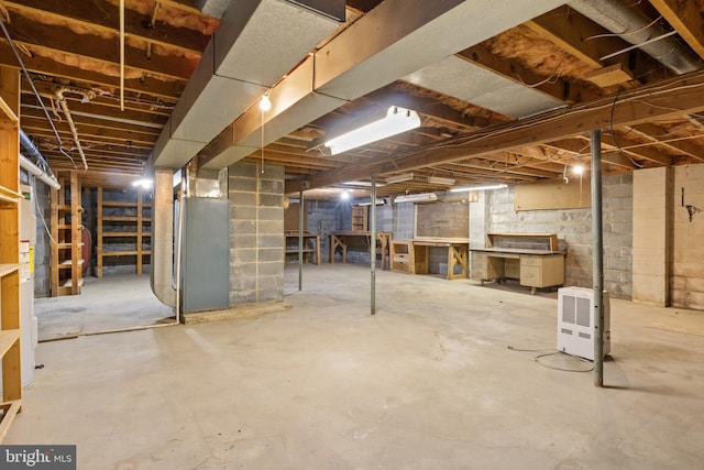 basement featuring heating unit