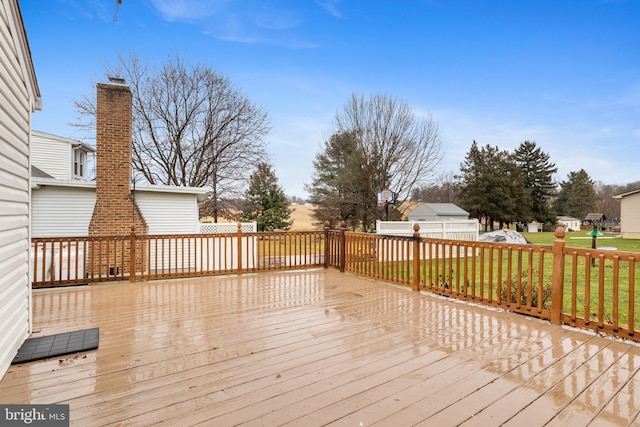 wooden terrace with a yard