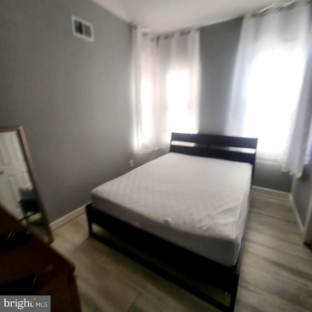 bedroom featuring wood-type flooring