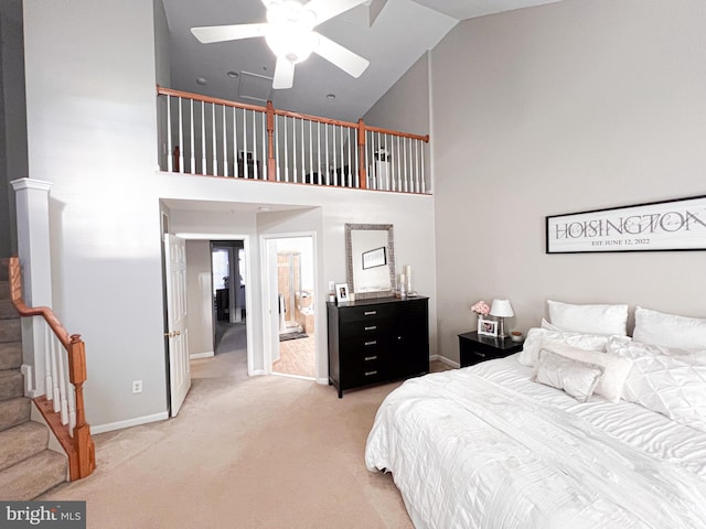 bedroom with carpet flooring, high vaulted ceiling, and ceiling fan