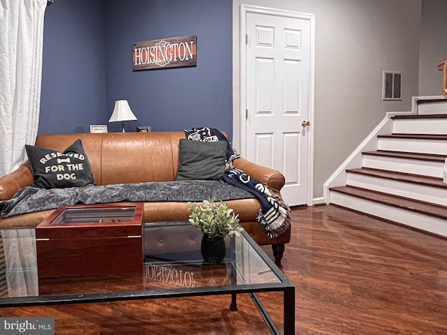 living room with dark hardwood / wood-style floors