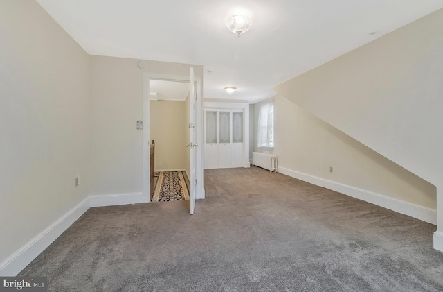 bonus room featuring lofted ceiling, radiator heating unit, and carpet flooring