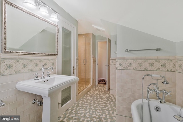 bathroom featuring separate shower and tub, tile walls, and tile patterned floors