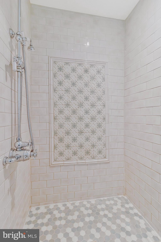 bathroom with tiled shower