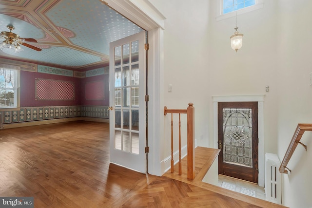 foyer with radiator and ceiling fan