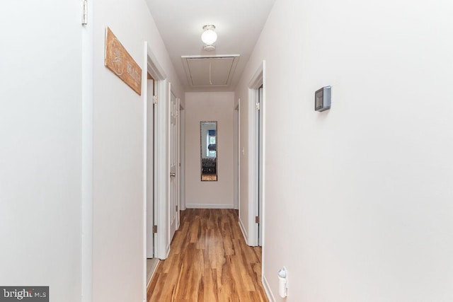 corridor featuring light hardwood / wood-style floors