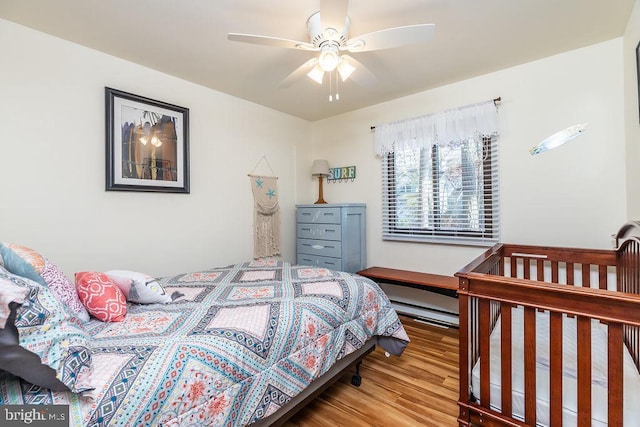 bedroom featuring ceiling fan and wood-type flooring