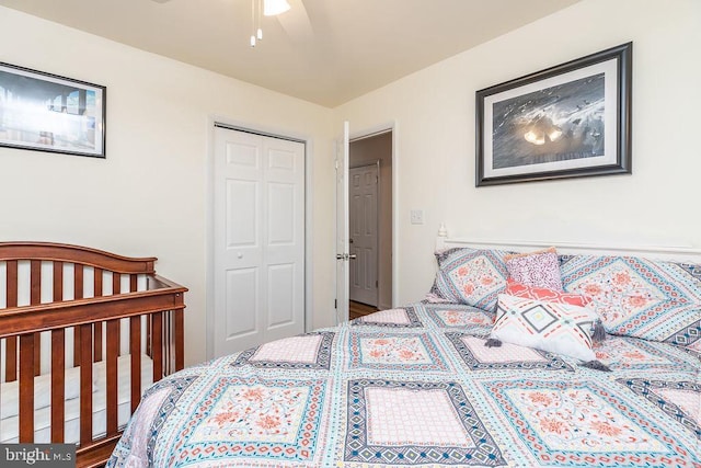 bedroom featuring wood-type flooring, a closet, and ceiling fan