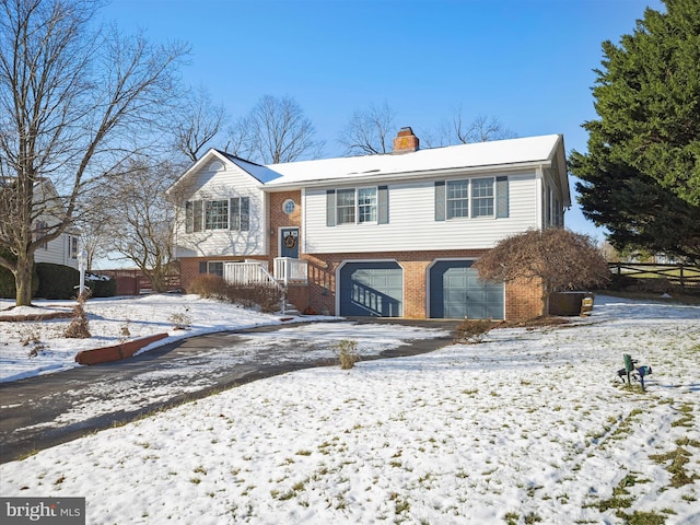 raised ranch featuring a garage