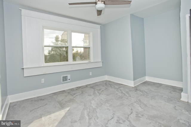 unfurnished room with ceiling fan