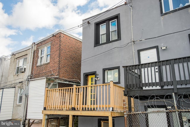 rear view of property featuring cooling unit