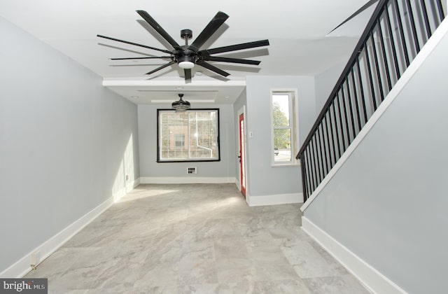 entryway featuring ceiling fan