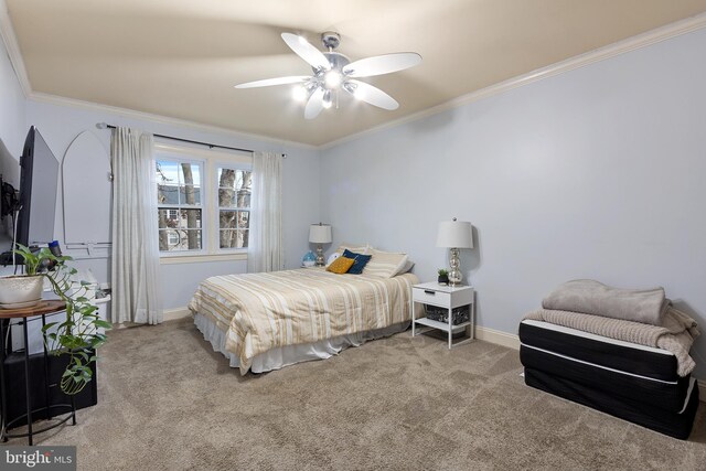 bedroom featuring ceiling fan, crown molding, and light colored carpet