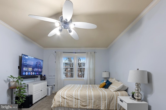 carpeted bedroom featuring ceiling fan and ornamental molding