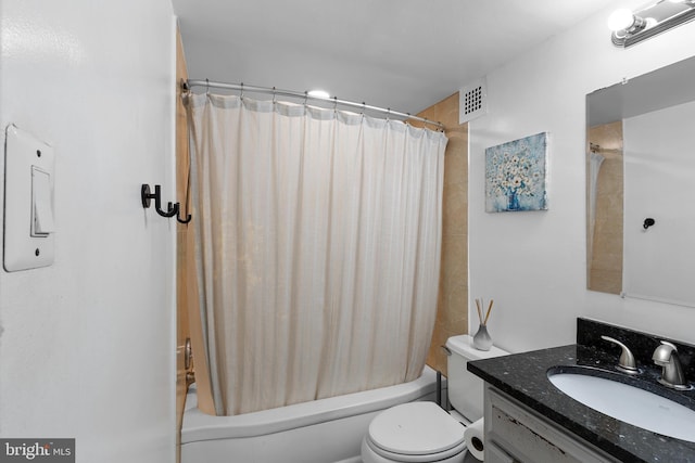 full bathroom featuring vanity, shower / bath combo, and toilet