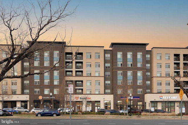 view of outdoor building at dusk