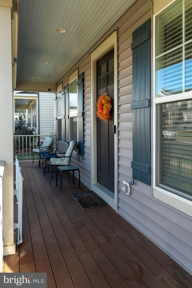 wooden terrace with covered porch