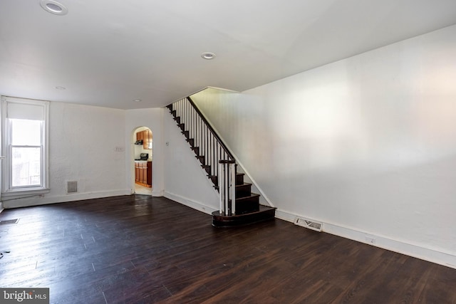 interior space with dark wood-type flooring