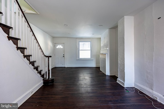 entryway with dark hardwood / wood-style floors