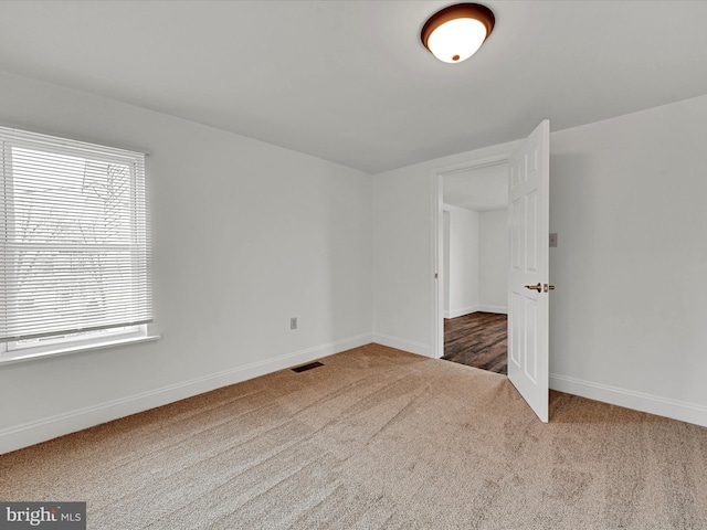 unfurnished bedroom featuring carpet flooring