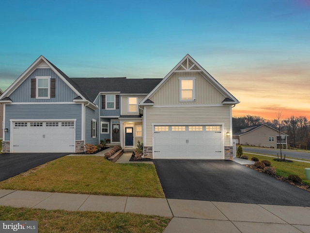 373 Guglielma Springett Dr, West Grove, PA 19390 - craftsman-style home featuring stone siding, driveway, an attached garage, a yard, and board and batten siding