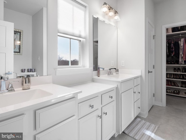 bathroom with tile patterned floors and vanity