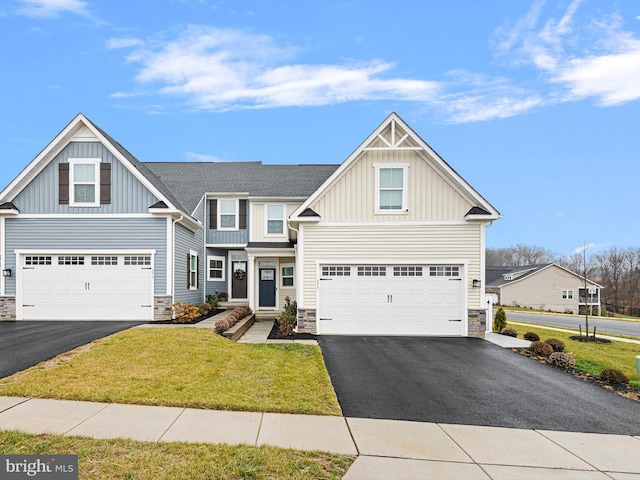 craftsman-style home with a front lawn and a garage