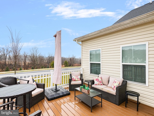 wooden terrace featuring an outdoor living space