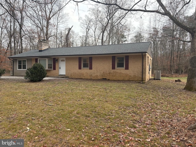 ranch-style home with central AC and a front yard