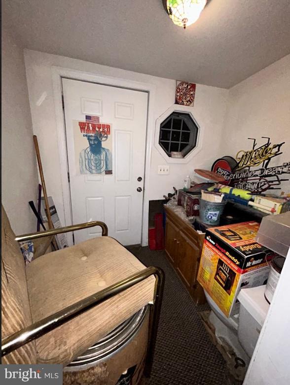 interior space with carpet and a textured ceiling