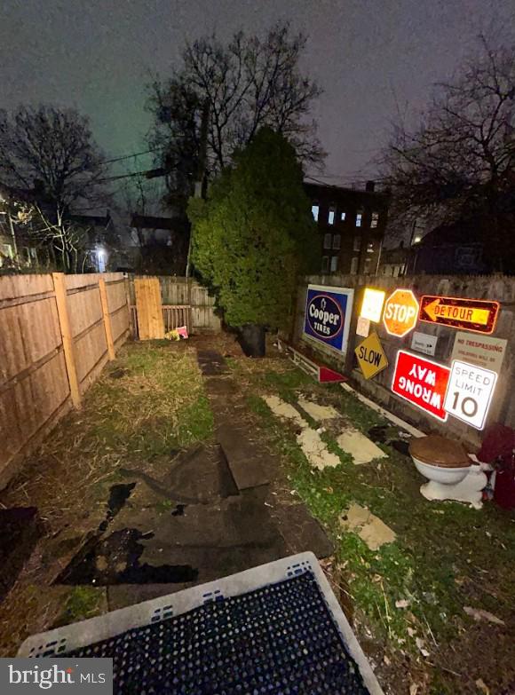 view of yard at twilight