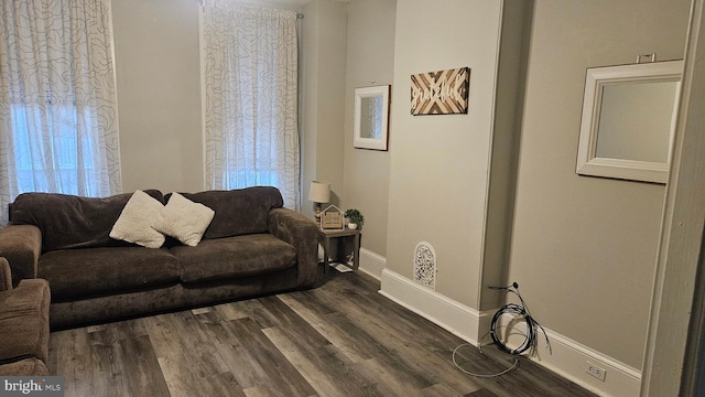 living room with dark hardwood / wood-style flooring