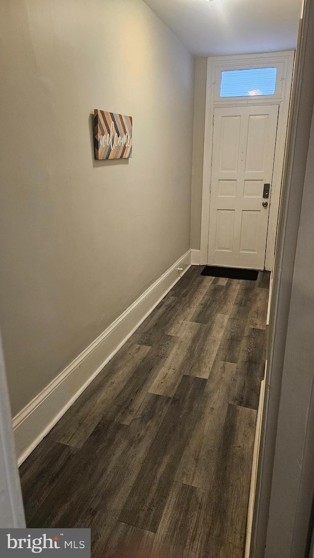 doorway to outside featuring dark hardwood / wood-style floors