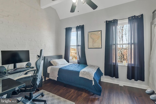 bedroom with lofted ceiling, ceiling fan, and dark wood-type flooring