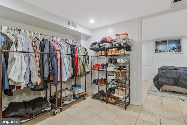 spacious closet with light tile patterned flooring