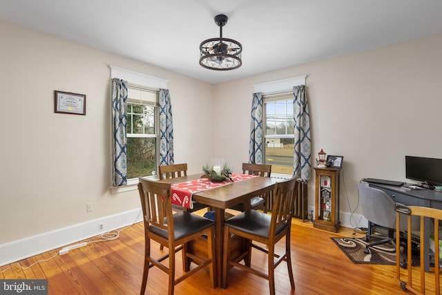 dining space featuring light wood-type flooring