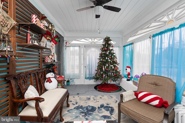 sitting room featuring ceiling fan, a healthy amount of sunlight, and ornamental molding