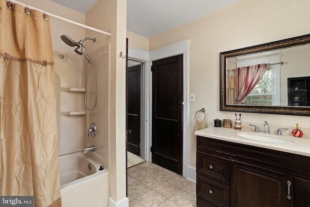 bathroom featuring tile patterned floors, shower / bath combo with shower curtain, and vanity