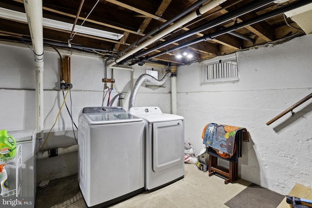 washroom featuring separate washer and dryer