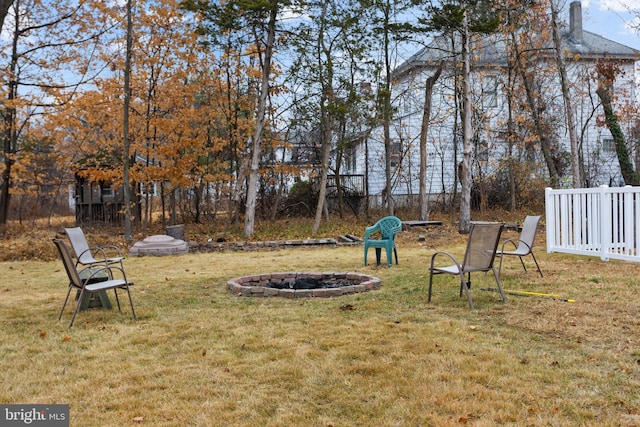 view of yard with an outdoor fire pit