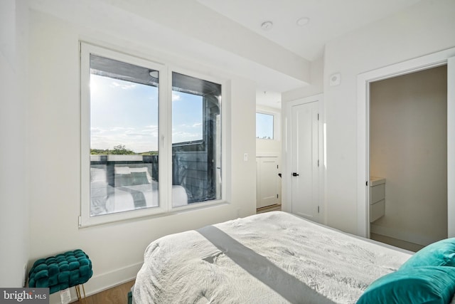 bedroom with hardwood / wood-style floors