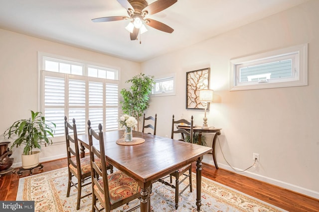 dining space featuring ceiling fan, hardwood / wood-style floors, and a wealth of natural light