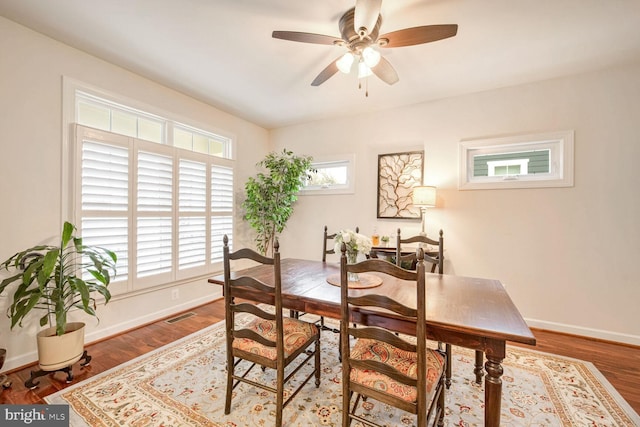 dining space featuring hardwood / wood-style flooring and ceiling fan