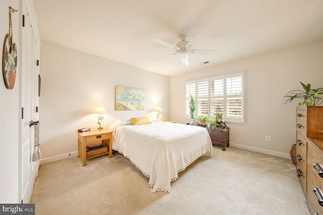 bedroom featuring ceiling fan and light colored carpet