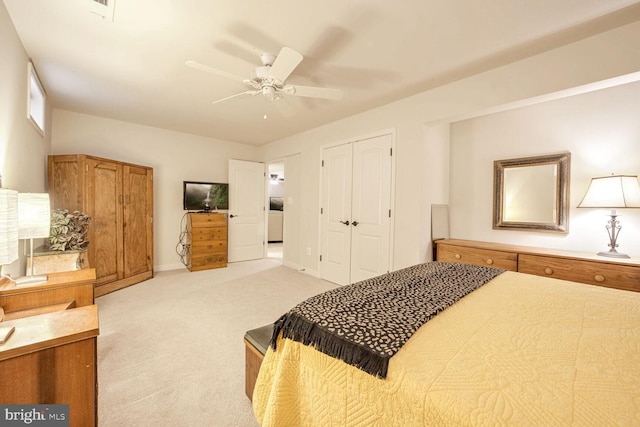 carpeted bedroom with a closet and ceiling fan